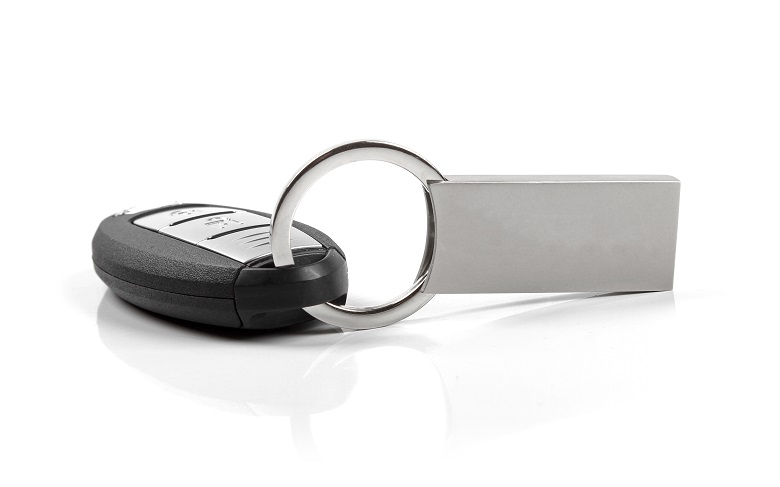 car key with blank keyring isolated on white